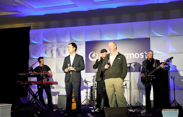 Mattermost speakers on stage at a company event