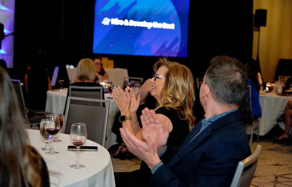 Team member applauding at a company gathering