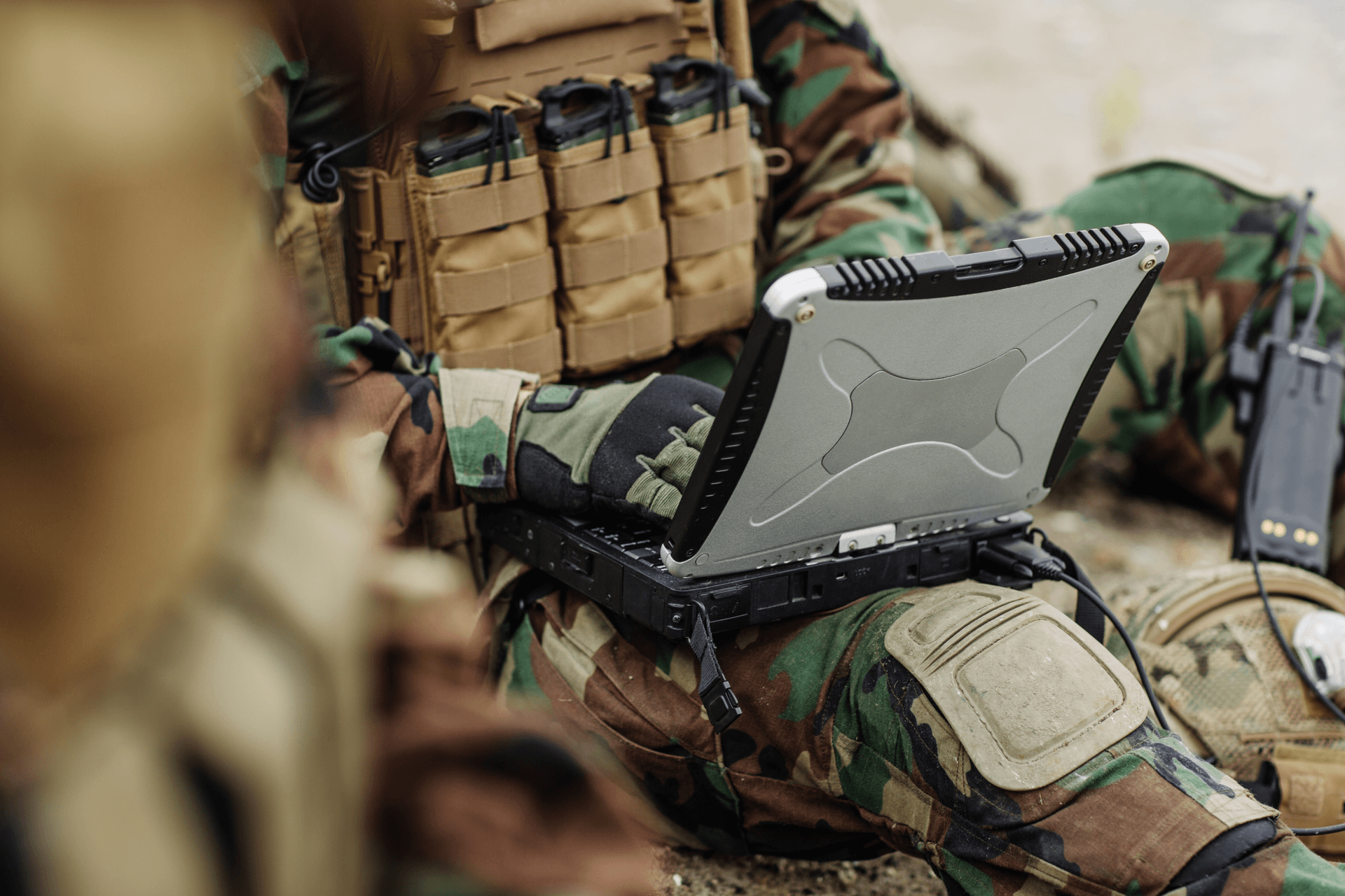 Field operator using Mattermost on a rugged laptop during a mission